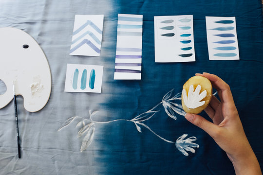Female Artist Making Textile Print with Potato Stamps
