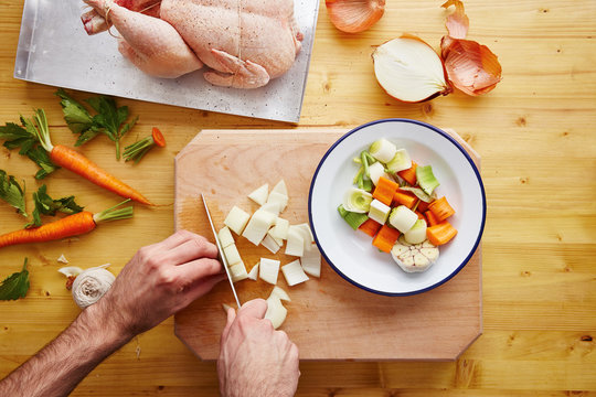 Preparing roast chicken with vegetables