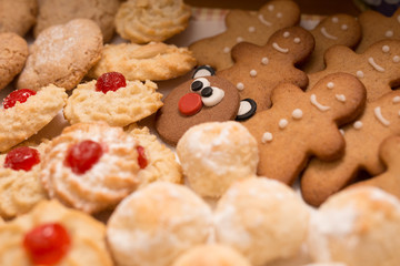 christmas cookies of various shapes with warm light