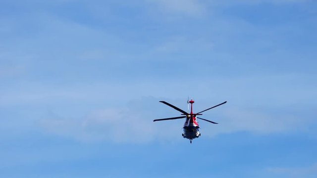 Helicopter service for oil and gas flying in the blue sky
