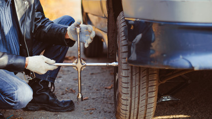 man changing wheel on a car