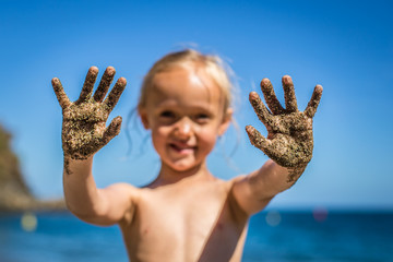 little girl with dirty hands