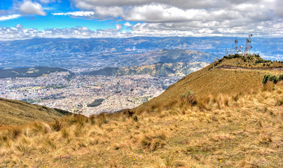 View of the city of Quito and the ecuadorian Andes from the Teleferico touristic attraction, at the top of the Pichincha volcano. Quito, Ecuador.