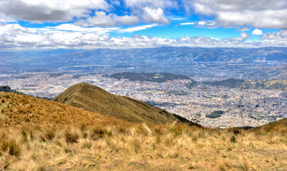 View of the city of Quito and the ecuadorian Andes from the Teleferico touristic attraction, at the top of the Pichincha volcano. Quito, Ecuador.