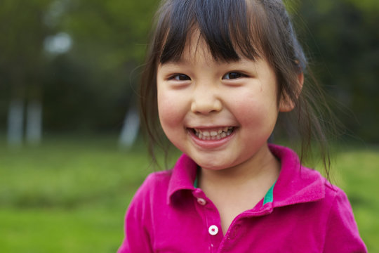 close up of little asian girl smile