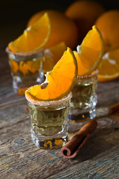 Gold tequila with orange and cinnamon .