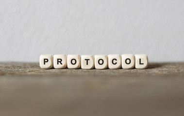 Word PROTOCOL made with wood building blocks
