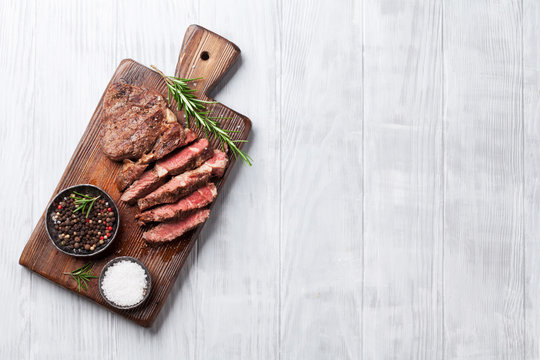 Grilled Beef Steak With Spices On Cutting Board