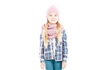 Studio portrait of little girl wearing knit hat and snood scarf