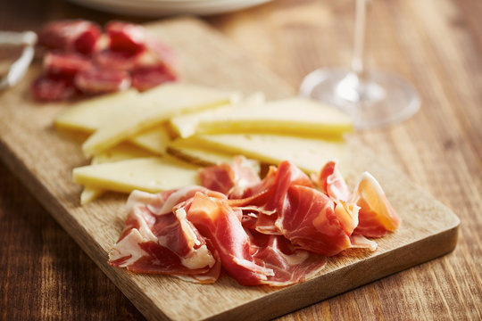 Typical spanish appetizers: jamon, cheese, dry sausages