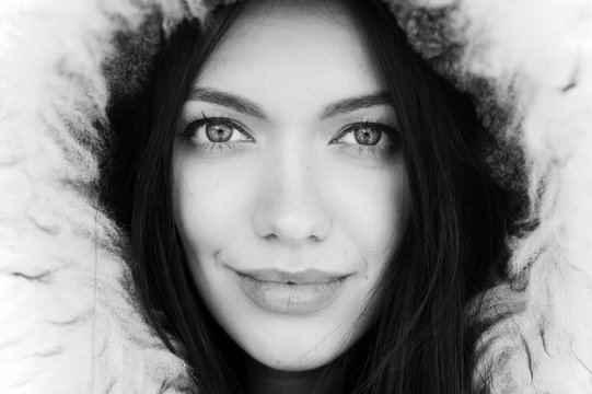 Close up portrait of beautiful woman wearing parka