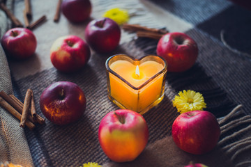 autumn still life - candle cinnamon apples