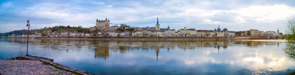 Panorama of Saumur old town and Loire river from the left bank, with medieval castle and church, in Saumur, France.