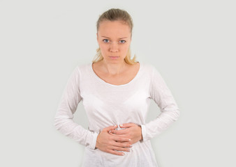 The young girl blondes stomach ache. mockup. Isolated on a white background.