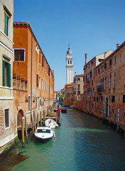 Fototapeta na wymiar The canal of Venice, Sunny day, Italy