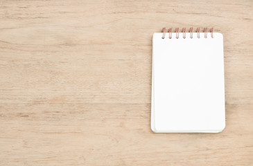 opened notebook on wood texture