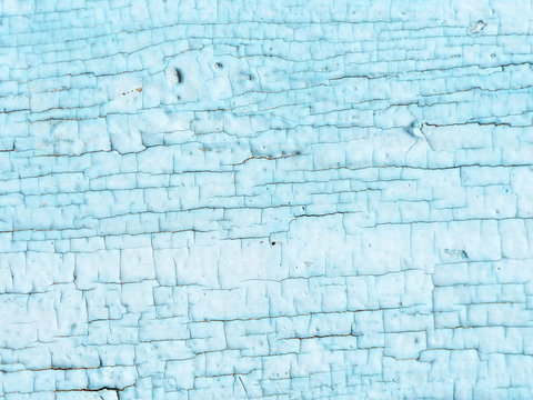Cracked light blue paint texture on a wooden surface, retro texture old painting