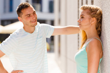 Man flirting with girl on city street