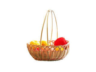 Fototapeta na wymiar Wicker basket with needlework. Basket with colorful skeins of yarn, tangles isolated on white background