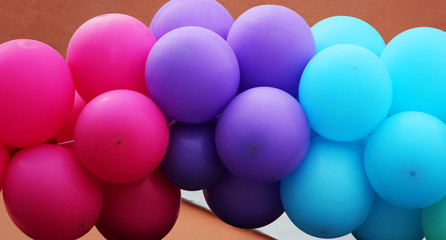 Many colorful air balloon like rainbow adorn the entrance to the cafe at its opening.