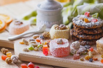 East sweets with candied fruits, nuts and sugar powder