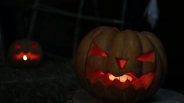 Scary luminous pumpkin Jack. Halloween and All Saints Day.