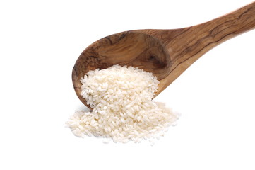 White rice pile in wooden spoon, isolated on white background