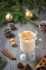 Obraz na płótnie Canvas Christmas drink eggnog with grated nutmeg and cinnamon