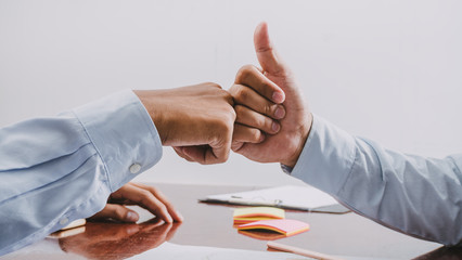 Fist bump, Teamwork coordinated well understood and successful work that has been done, The concept...