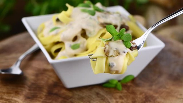 Some homemade Porcini pasta (not loopable; roating) as 4K UHD footage