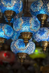 Rolgordijnen Decorative blue chandeliers in bazaar. Close up. Turkey © OlegD