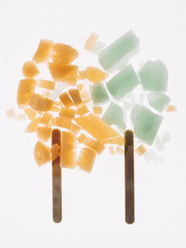 two smashed popsicles on a white background