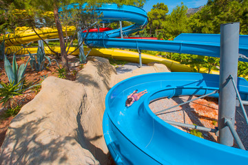 Young girl on water slide at aquapark