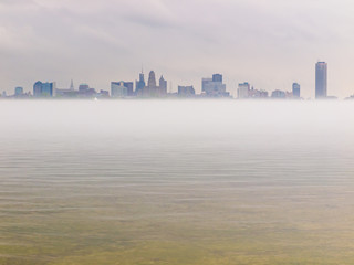 Buffalo NY skyline across mist-covered water
