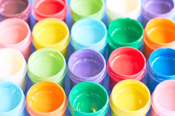 background of jars with colored paints