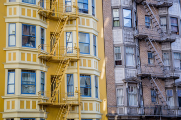 Downtown Building Colors / Color contrast of outer facade of two brick apartment buildings in a...