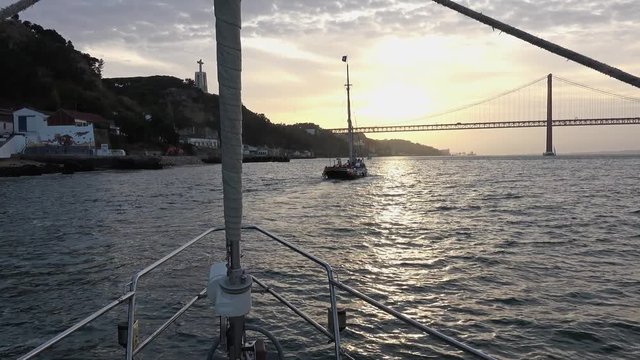POV Sailboat In Tagus River, Lisbon Landmarks. Lisbon is the capital and the largest city of Portugal