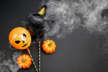 holidays, decoration and party concept - air balloons for halloween over black background.Top view