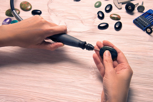 Jeweler working with dremel