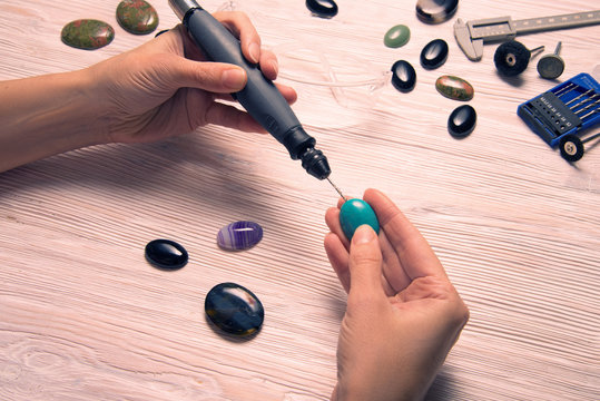 Jeweler working with dremel
