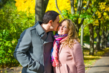 Fototapeta premium A cheerful and positive couple man and woman are walking in the city, relaxing and enjoying time with each other. The concept of feelings and love in middle-aged people