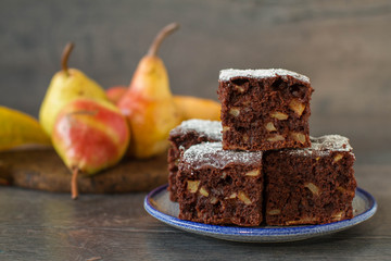 Chocolate cake with pears in rustic style
