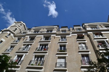 Fototapeta na wymiar Idyllic residential buildings in Paris, in 18th arrondissement, in Montmartre district, France