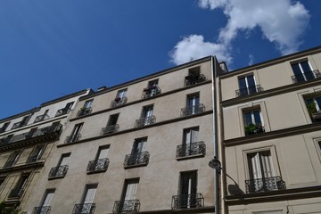Fototapeta na wymiar Idyllic residential buildings in Paris, in 18th arrondissement, in Montmartre district, France