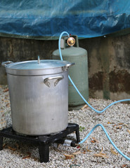 aluminum pot with gas canister in the camp kitchen while prepari