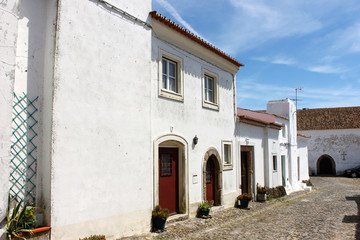 Fototapeta na wymiar The streets and houses of Evora Monte, a walled town in the Alentejo region of Portugal