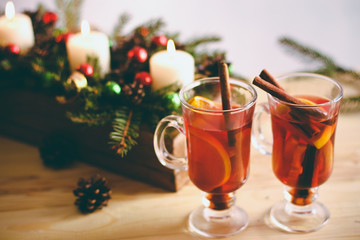 Beautiful Christmas mulled wine in a glass in decorating  New Year interior background