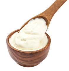Fototapeta na wymiar Sour cream in wooden spoon isolated on white background