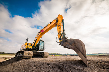 Big excavator in construction site