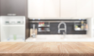 Wood table top on blur kitchen room background .For montage product display or key visual layout.